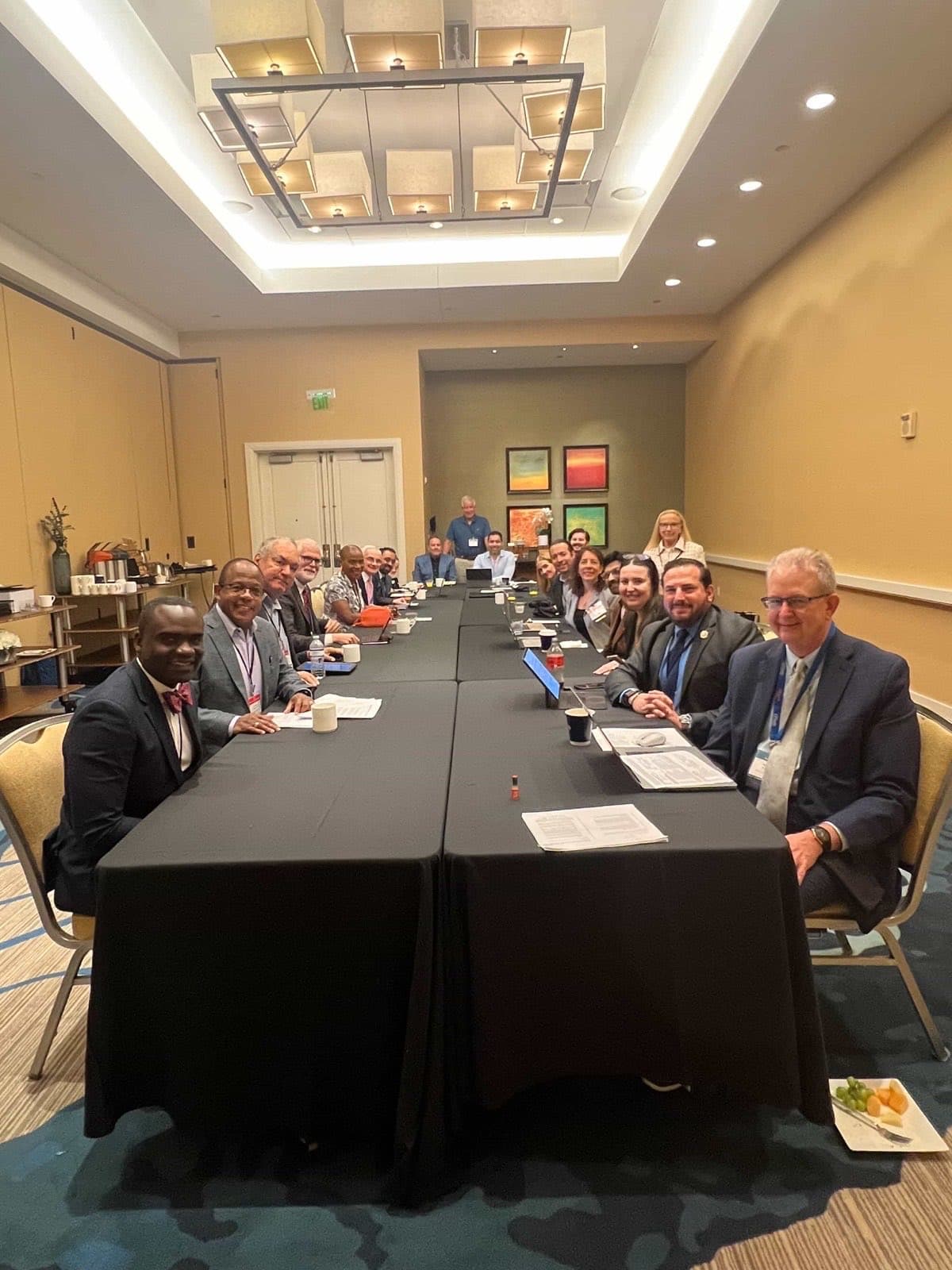 Chapter leaders gathered around the table at a committee meeting